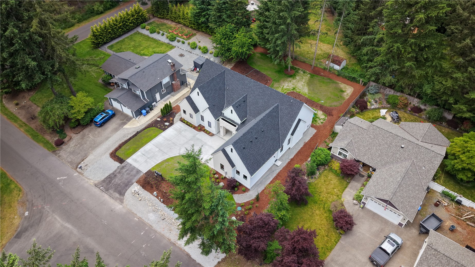 6709 254th Street East Graham, WA 98338 - Photo 38 of 40 an aerial view of a house with outdoor space and a swimming pool