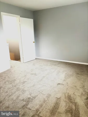 a bathroom with a toilet and shower