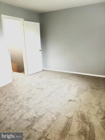 a bathroom with a toilet and shower