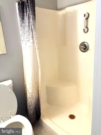 a bathroom with a toilet and a sink