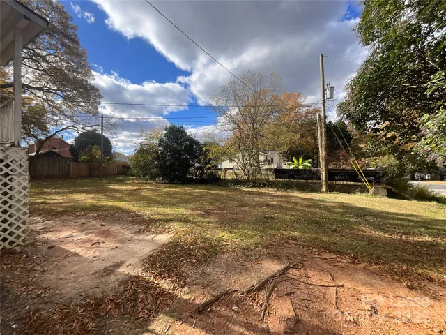 a view of road with large trees