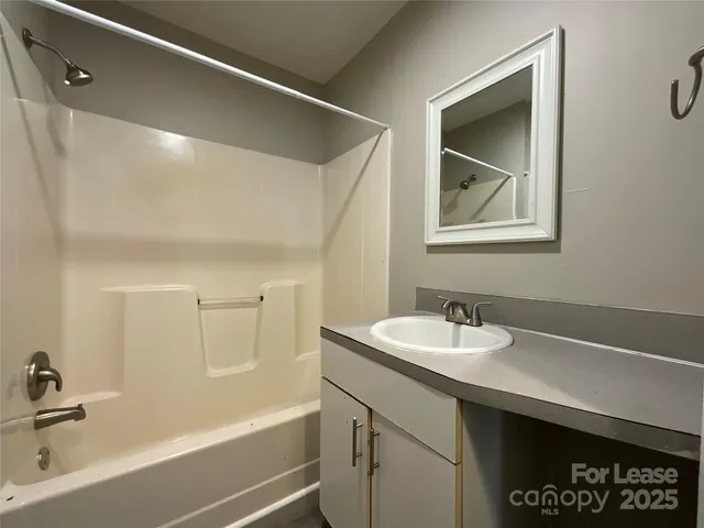 a bathroom with a sink and a bathtub