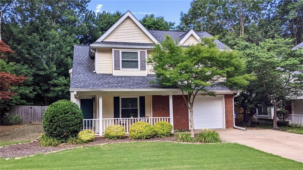 898 Halston Court Marietta, GA 30062 - Photo 1 of 1 a front view of a house with garden