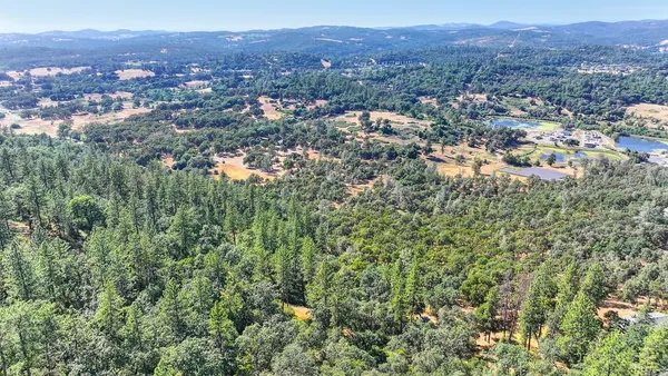 an aerial view of residential house and green space