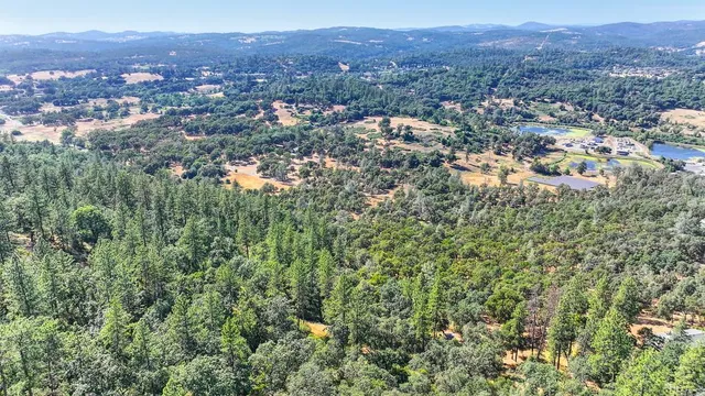 an aerial view of residential house and green space