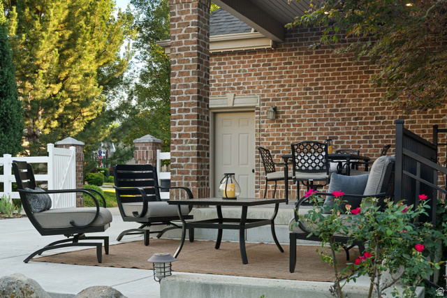 875 South 1250th Street East Mapleton, UT 84664 - Photo 12 of 54 Expansive brick patio with concrete surfacing and a partial brick facade