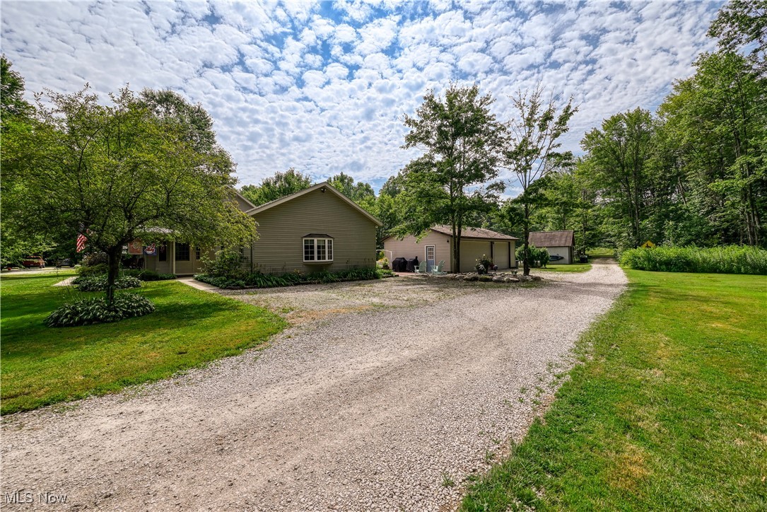 6640 Giddings Road Rootstown, OH 44272 - Photo 5 of 49 View of front of home featuring driveway and a front lawn