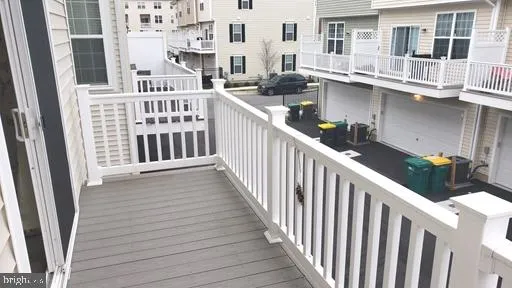 a view of balcony with furniture and wooden floor