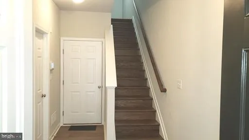 a view of a hallway with the wooden floor