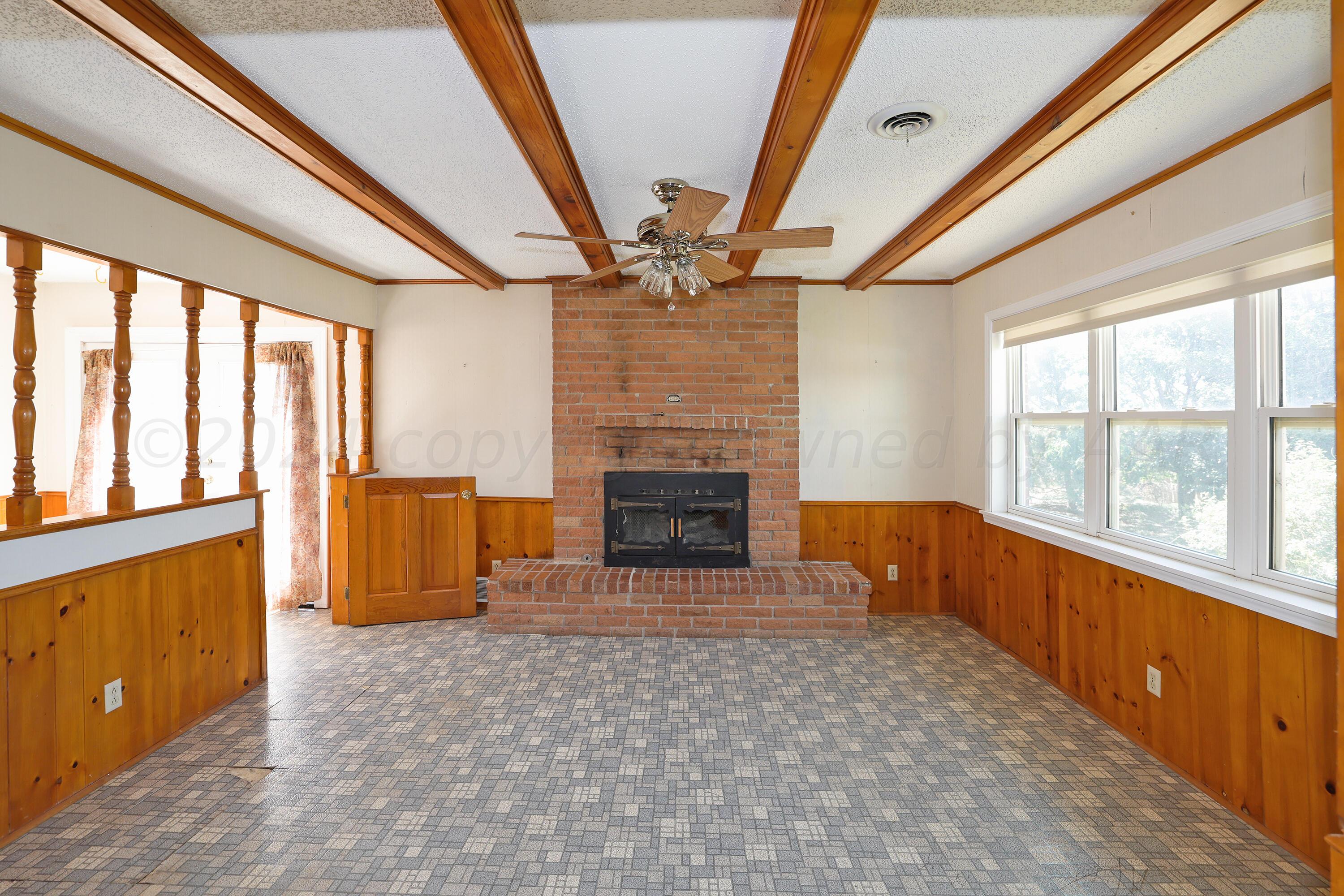 6801 South Blessen Road Amarillo, TX 79119 - Photo 11 of 36 Den Fireplace