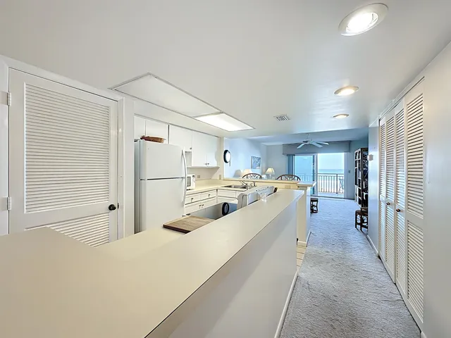 a kitchen that has a sink and a stove