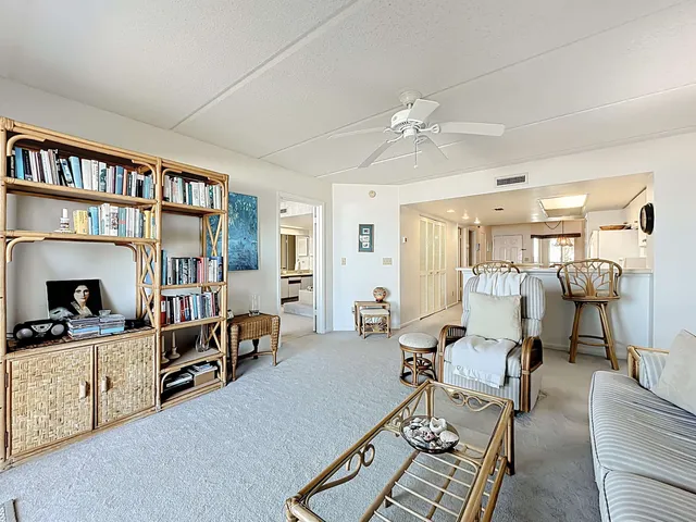 a living room with furniture a gym equipment and a view of living room