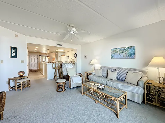 a bedroom with two beds and a chandelier