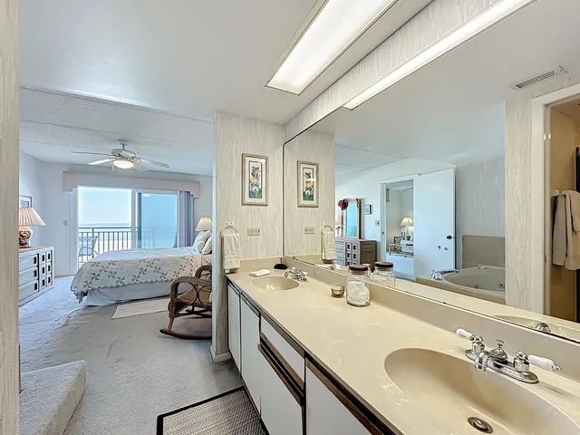 a spacious bedroom with a bed and a couch