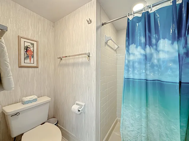 a balcony with table and chairs