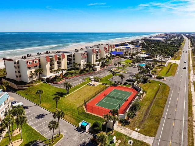 a room with lots of gym equipment and lots of windows