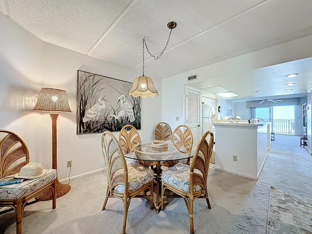a room with chandelier and windows