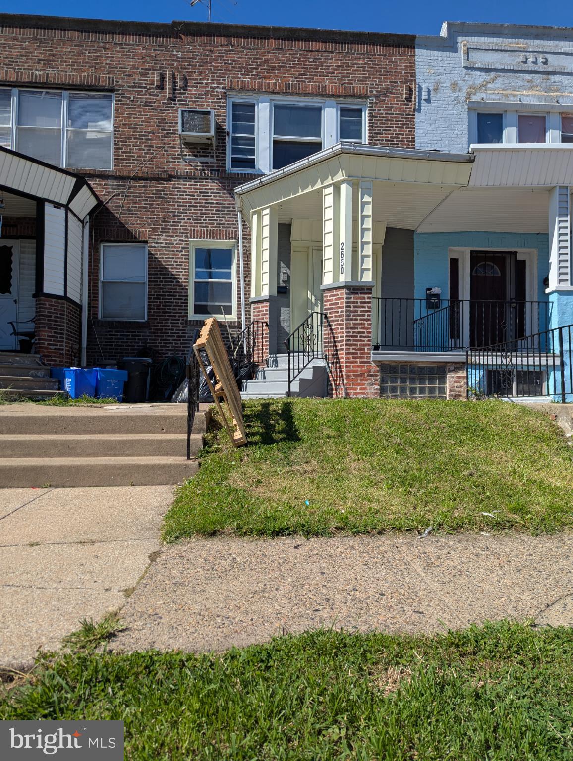 2650 South 68th Street Philadelphia, PA 19142 - Photo 2 of 12 a front view of a house with a yard