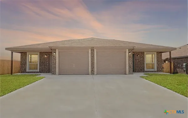 front view of house with yard and green space