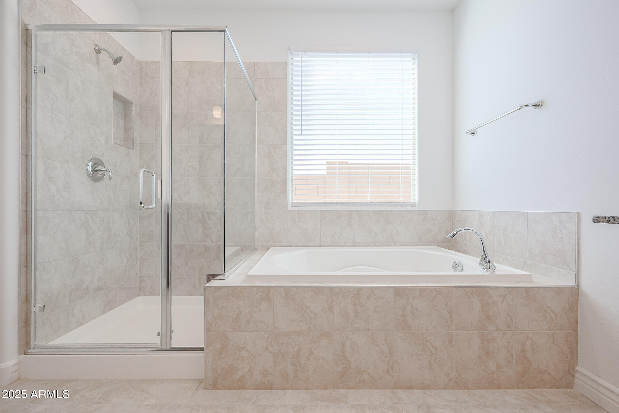 25110 North 170th Lane Surprise, AZ 85387 - Photo 11 of 20 a spacious bathroom with a bathtub and shower