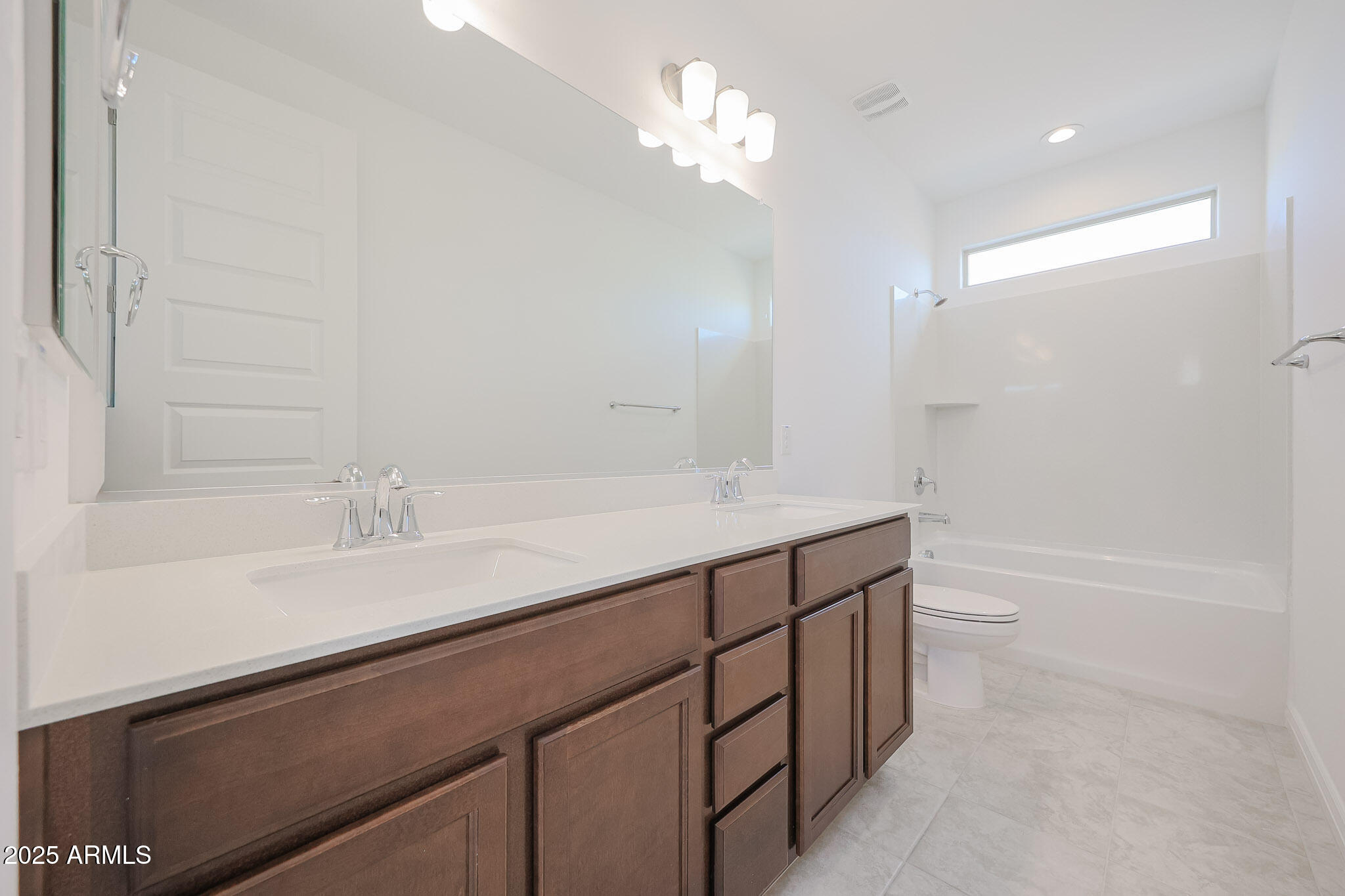 25110 North 170th Lane Surprise, AZ 85387 - Photo 14 of 20 a bathroom with a sink a toilet and a bathtub