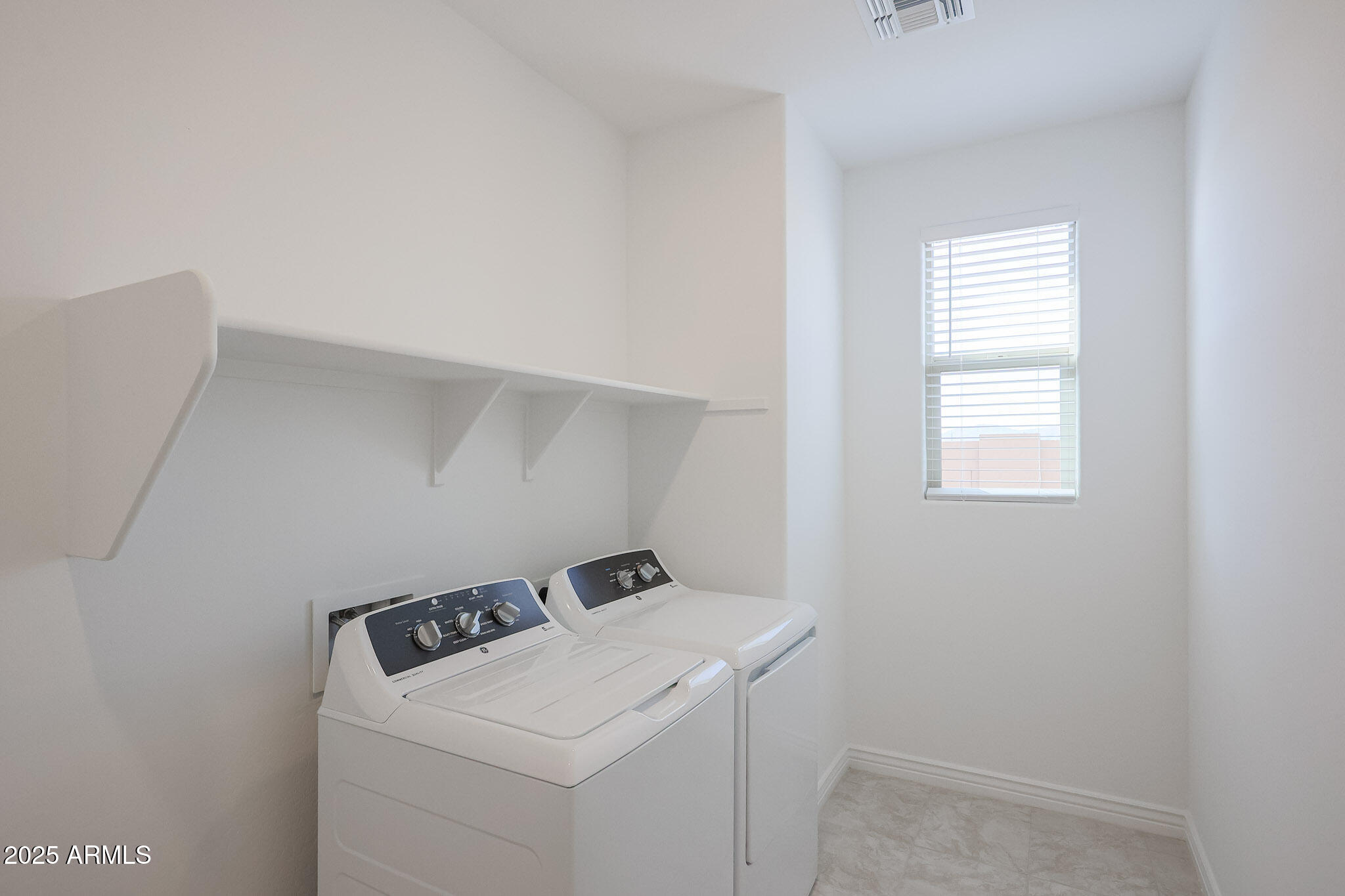 25110 North 170th Lane Surprise, AZ 85387 - Photo 17 of 20 a utility room with dryer and washer