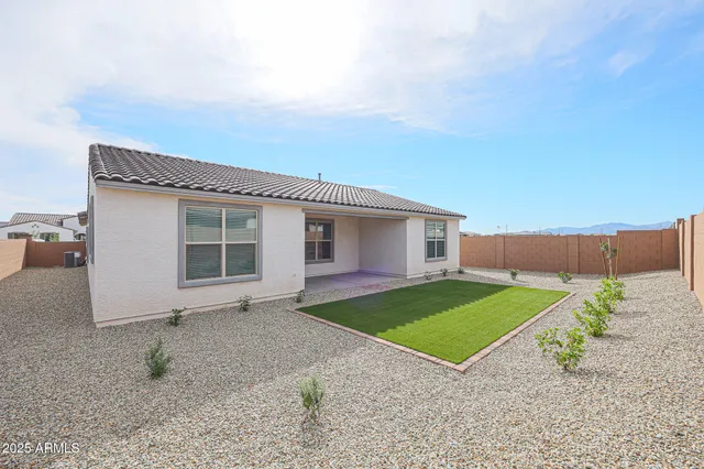 a view of a house with a yard and garage