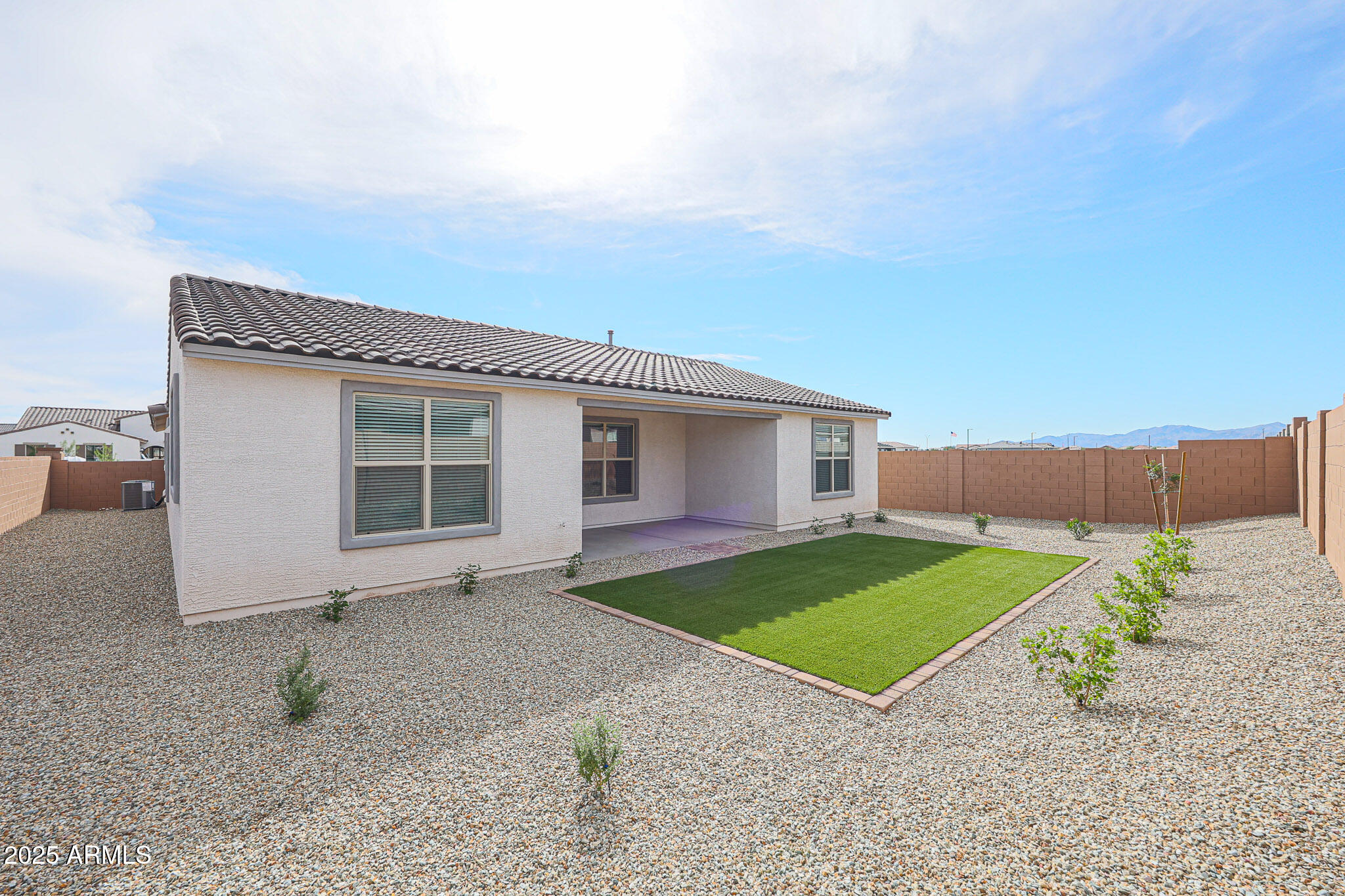 25110 North 170th Lane Surprise, AZ 85387 - Photo 18 of 20 a view of a backyard with a garden and plants