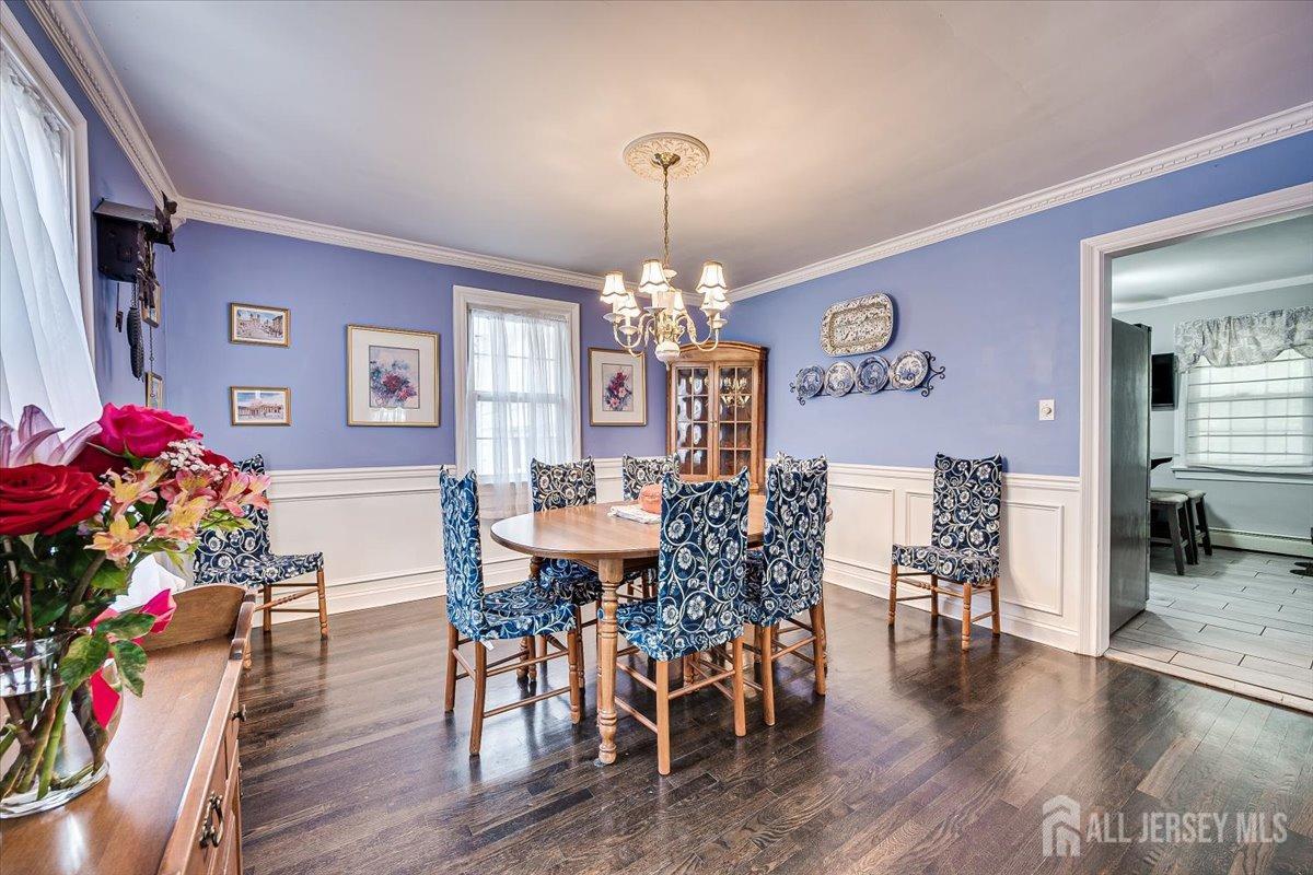 137 5th Street Edison, NJ 08837 - Photo 14 of 52 a view of a dining room with furniture and wooden floor