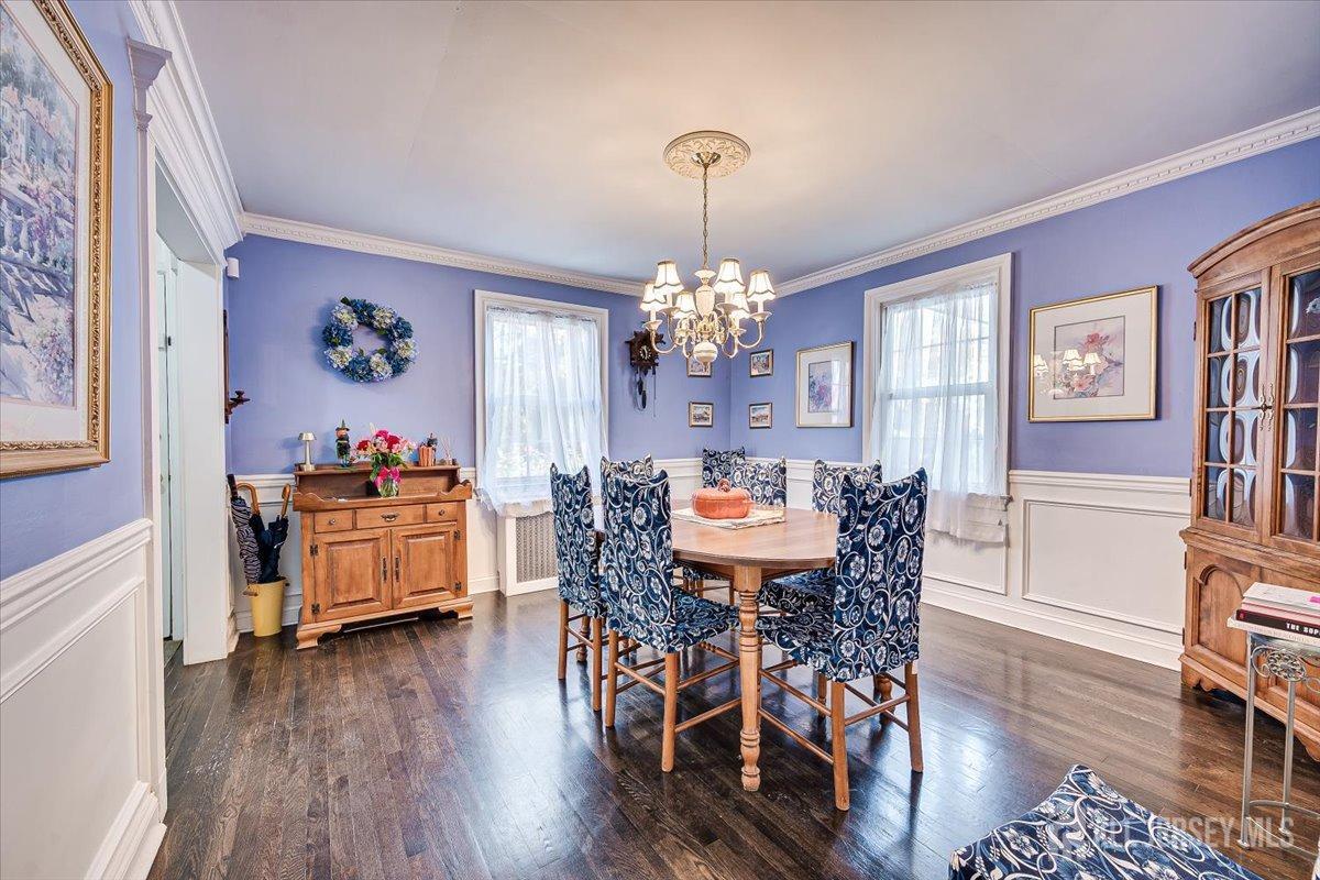 137 5th Street Edison, NJ 08837 - Photo 16 of 52 a view of a dining room with furniture and wooden floor