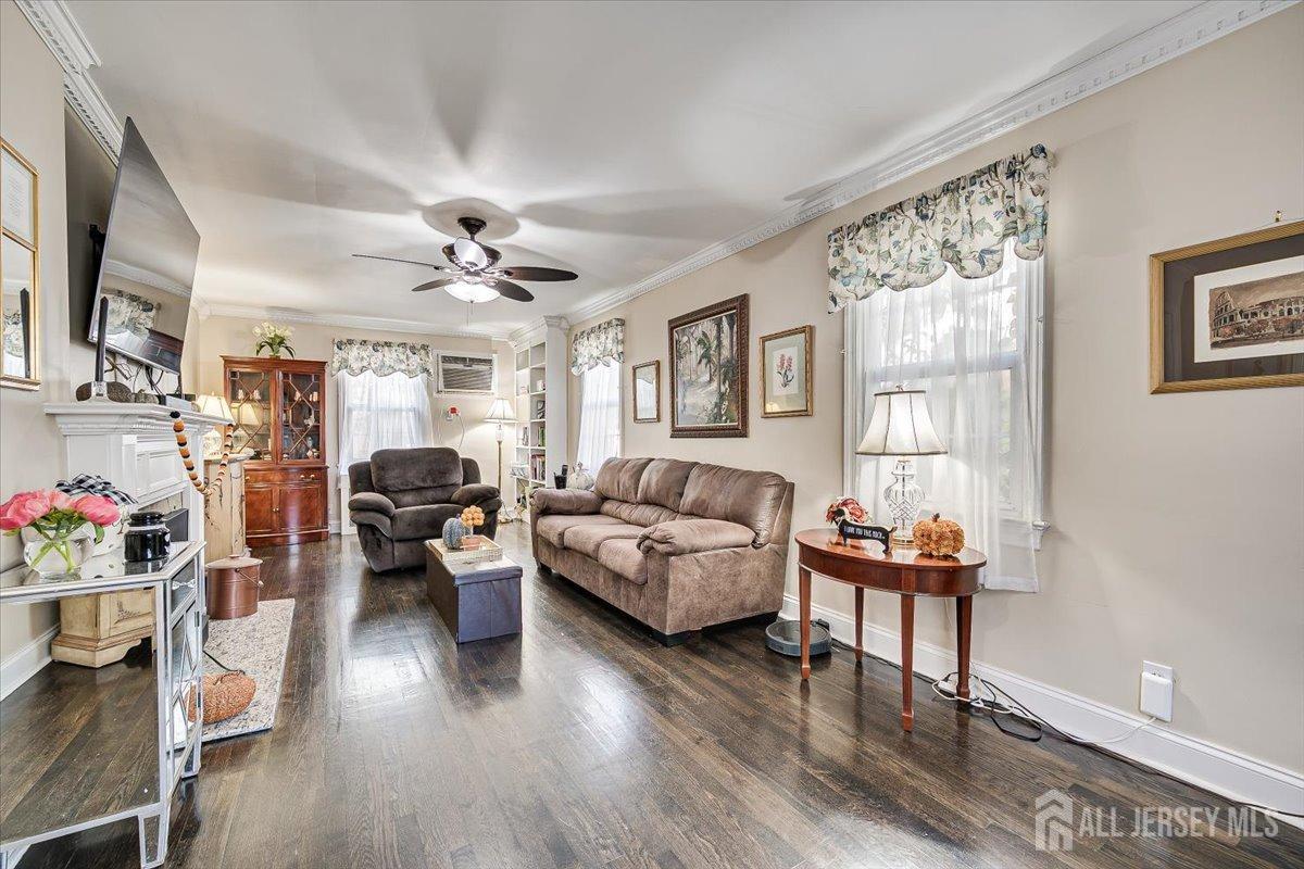 137 5th Street Edison, NJ 08837 - Photo 23 of 52 a living room with furniture or couch and a wooden floor
