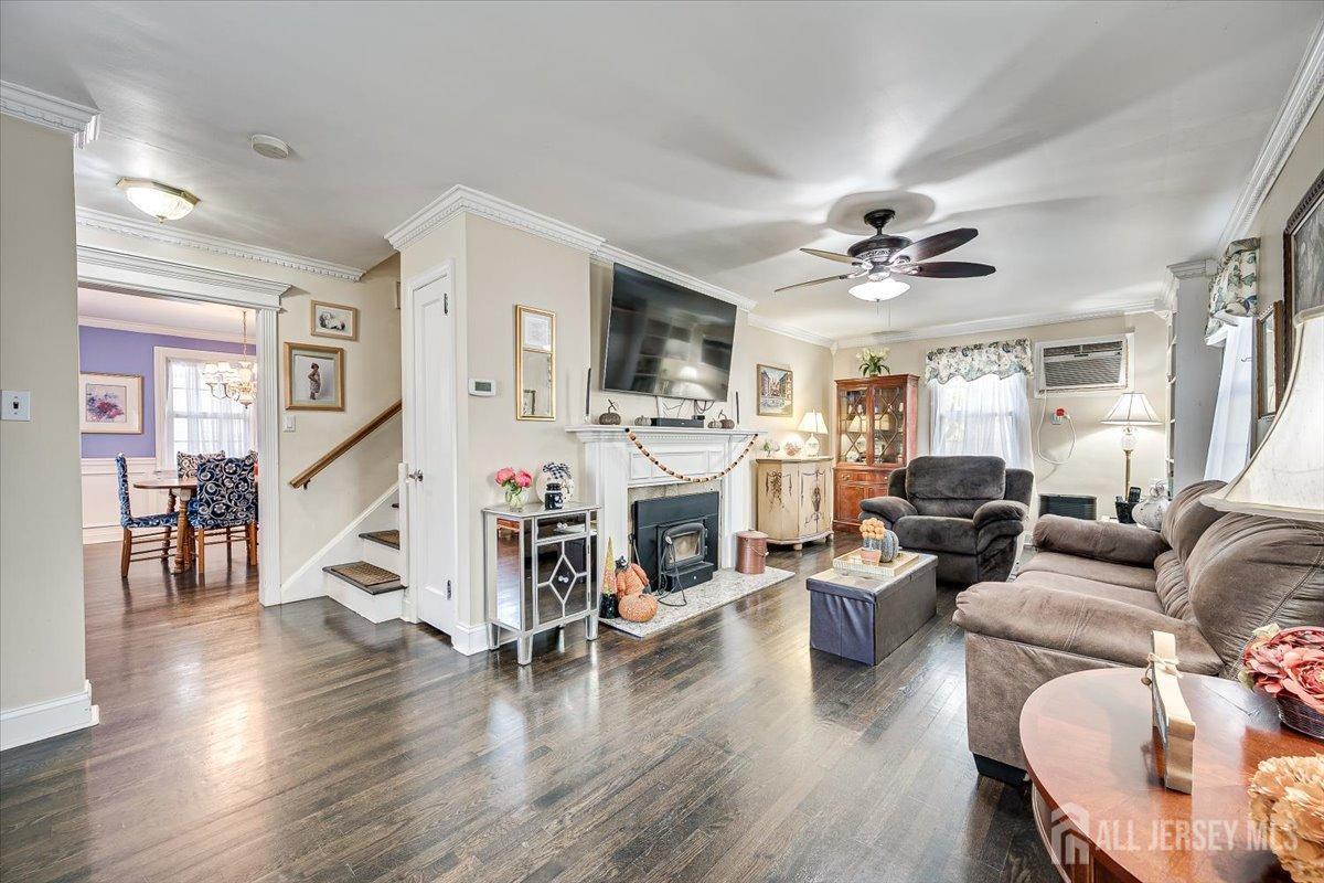 137 5th Street Edison, NJ 08837 - Photo 24 of 52 a living room with fireplace furniture and a wooden floor