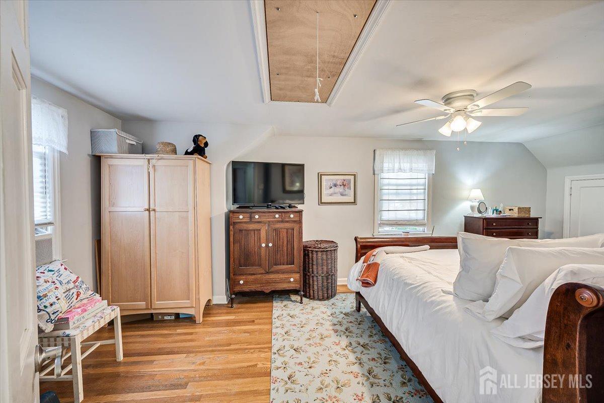 137 5th Street Edison, NJ 08837 - Photo 27 of 52 a bedroom with a bed dresser and a window