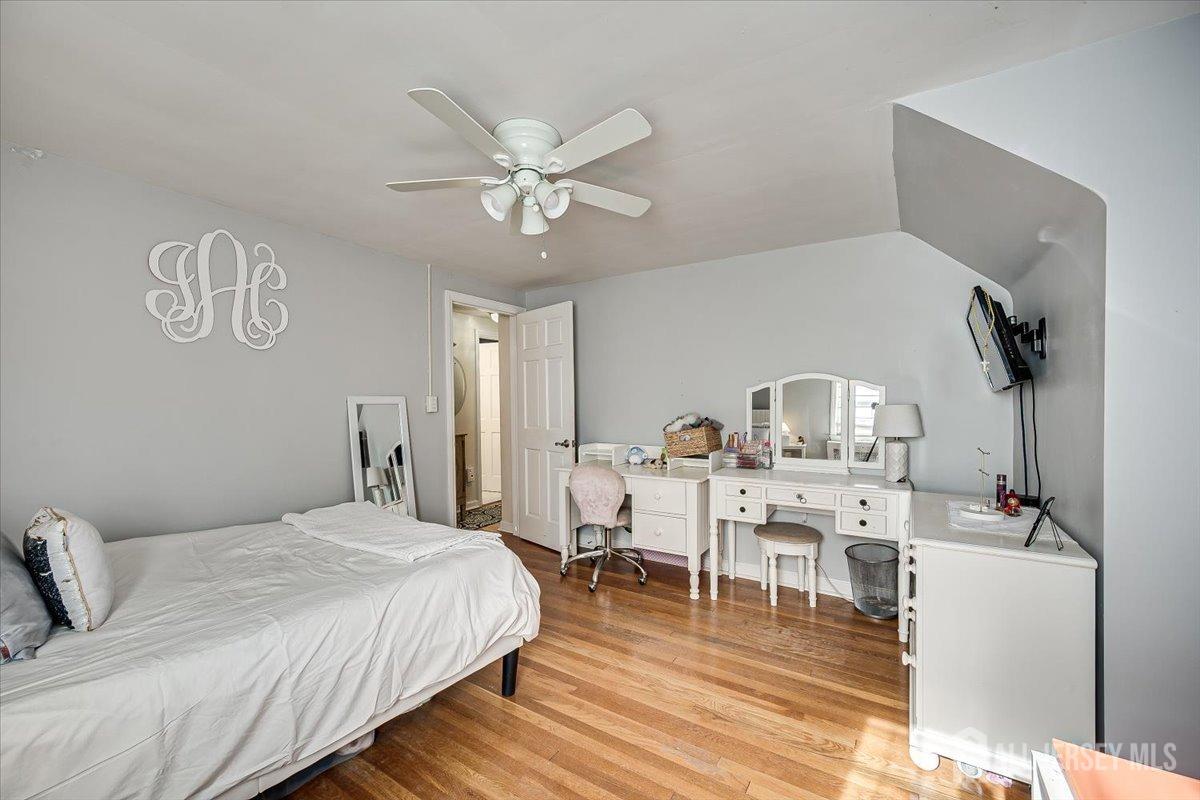 137 5th Street Edison, NJ 08837 - Photo 33 of 52 a bedroom with furniture and wooden floor