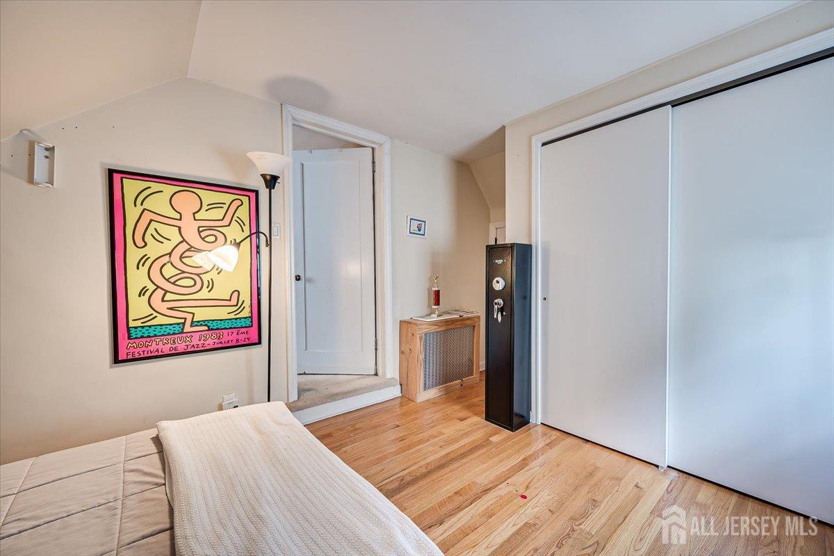 137 5th Street Edison, NJ 08837 - Photo 38 of 52 a bedroom with a bed and a window