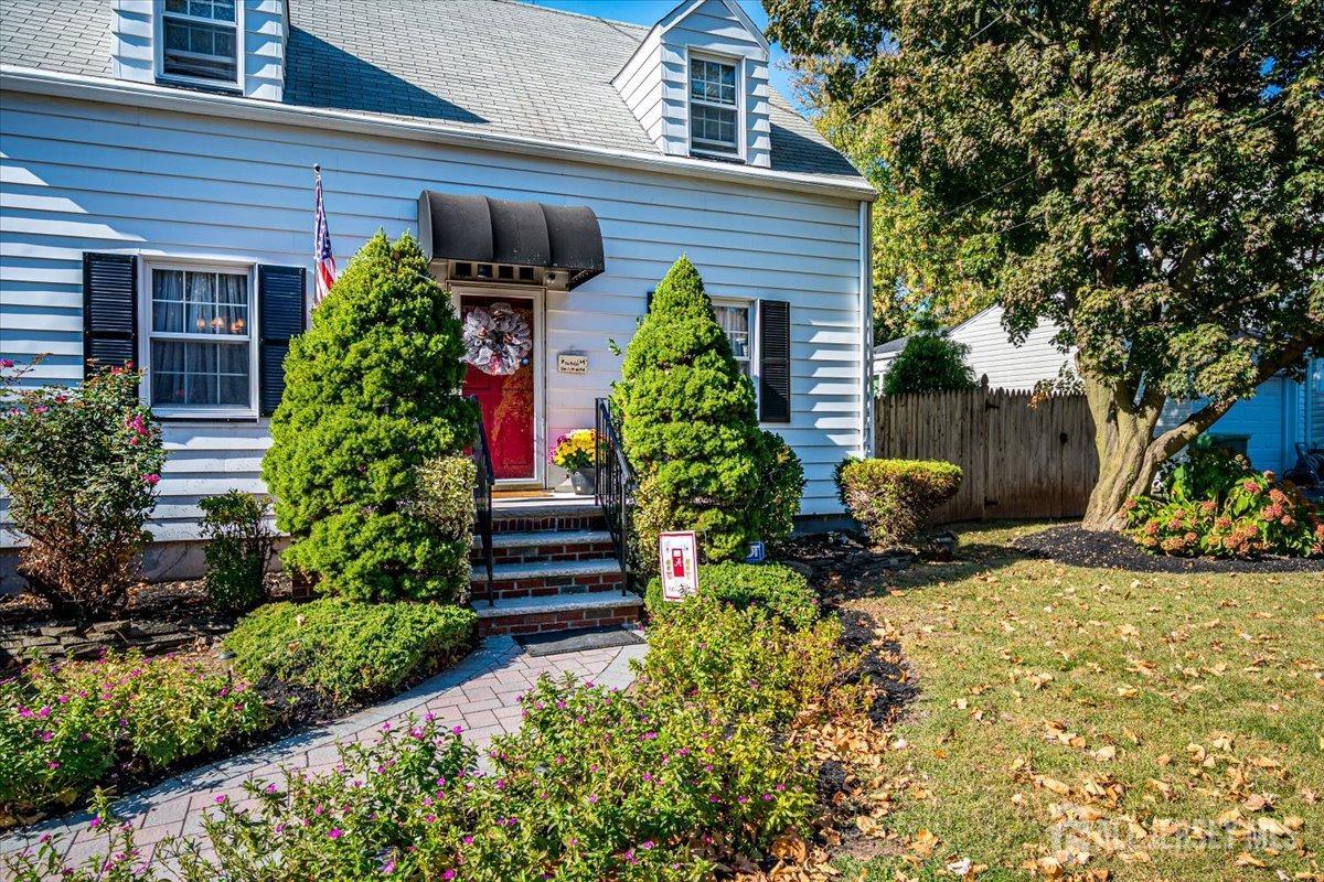 137 5th Street Edison, NJ 08837 - Photo 4 of 52 a view of a house with a flower garden