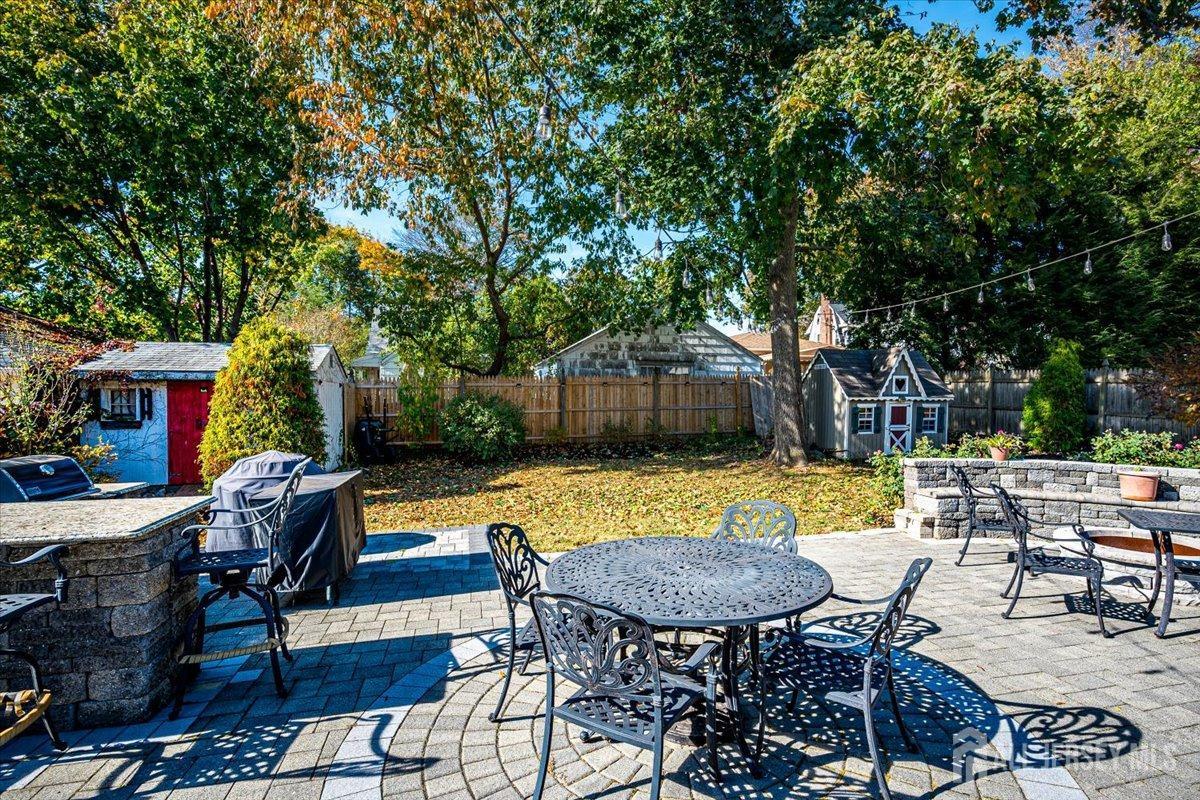 137 5th Street Edison, NJ 08837 - Photo 43 of 52 a swimming pool with outdoor seating and yard