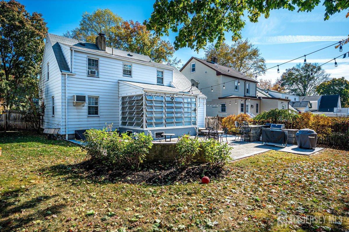 137 5th Street Edison, NJ 08837 - Photo 45 of 52 a view of a house with backyard sitting area and garden