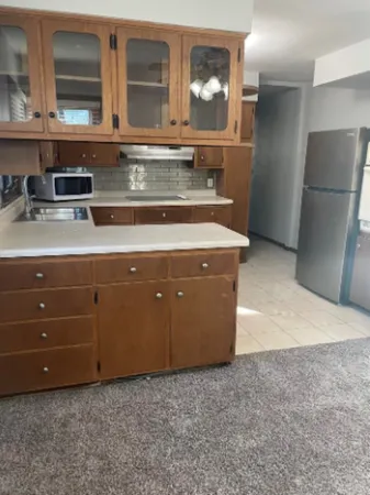 a view of a kitchen with a sink