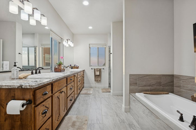 2925 Juniper Road Enterprise, UT 84725 - Photo 21 of 56 Bathroom with double vanity, a garden tub, a shower stall, and recessed lighting