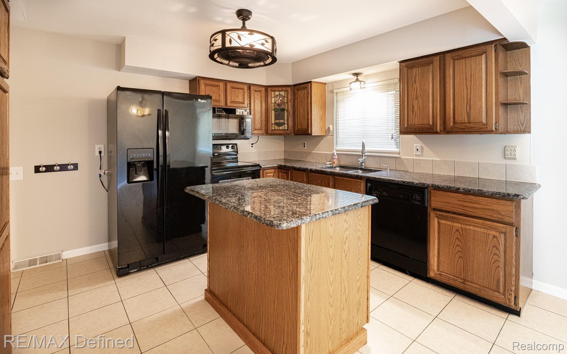 2850 Harrington Road Rochester, MI 48307 - Photo 6 of 25 Updated Kitchen with Granite Counters