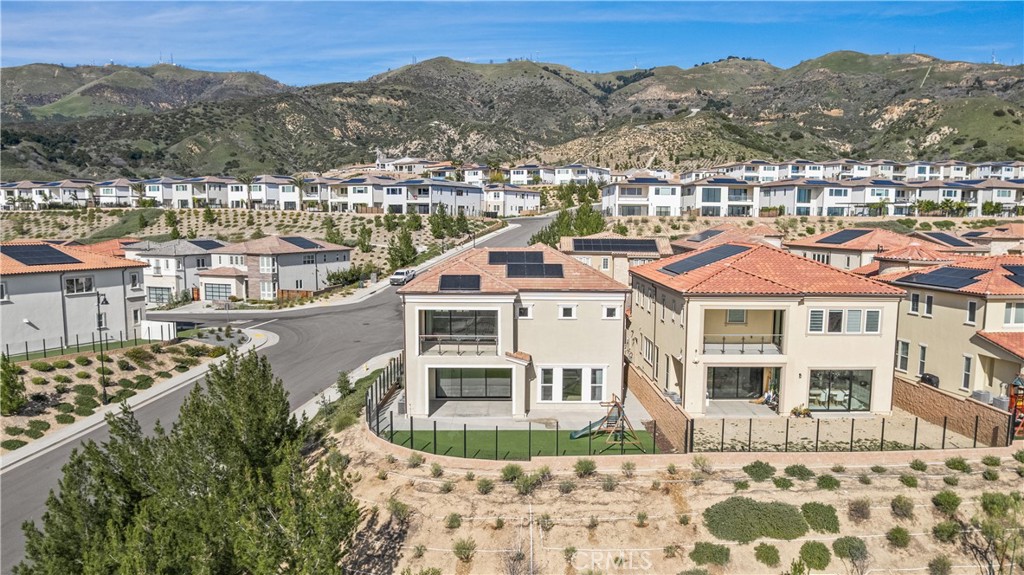 20638 Deer Grass Court Porter Ranch, CA 91326 - Photo 46 of 50 a view of a white building with a mountain in the background