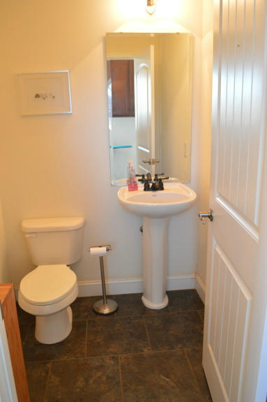 357 Sam Reed Road Northwest Floyd, VA 24091 - Photo 14 of 105 a bathroom with a sink toilet and mirror