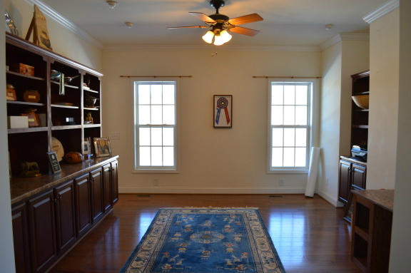 357 Sam Reed Road Northwest Floyd, VA 24091 - Photo 23 of 105 a view of an empty room with a window and wooden floor