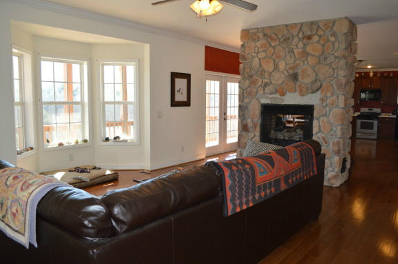 357 Sam Reed Road Northwest Floyd, VA 24091 - Photo 25 of 105 a living room with a bed and a fireplace