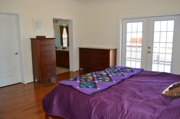 357 Sam Reed Road Northwest Floyd, VA 24091 - Photo 32 of 105 a bedroom with a bed and a dresser