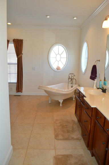 357 Sam Reed Road Northwest Floyd, VA 24091 - Photo 33 of 105 a spacious bathroom with a double vanity sink and a mirror