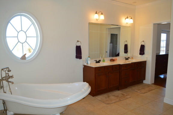 357 Sam Reed Road Northwest Floyd, VA 24091 - Photo 37 of 105 a bathroom with a tub sink and mirror