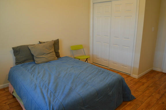 357 Sam Reed Road Northwest Floyd, VA 24091 - Photo 54 of 105 a bedroom with a bed and wooden floor