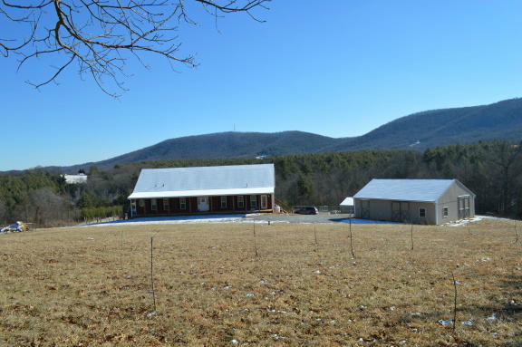 357 Sam Reed Road Northwest Floyd, VA 24091 - Photo 63 of 105 a view of a house with a yard and a large tree